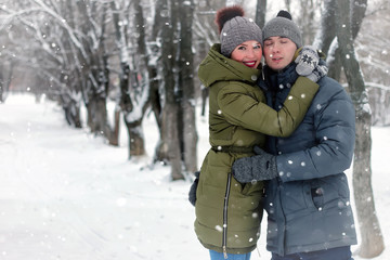Fototapeta na wymiar family couple walk winter snow