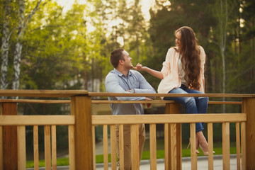 Young attractive couple in love at a park