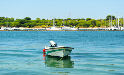 Fototapeta na wymiar Boat with outboard motor in El Rompido, Huelva, Spain