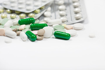 Pills close up on a light background.