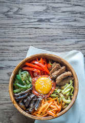Bowl of bibimbap on the wooden table