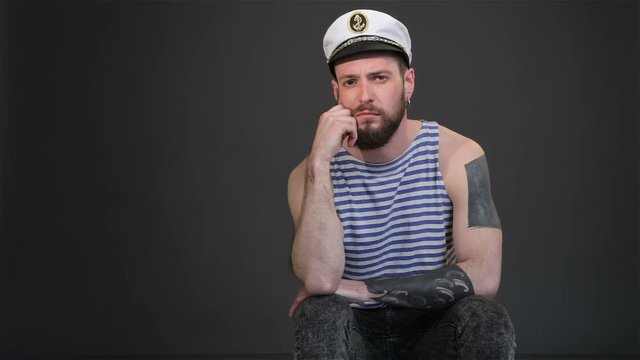Bearded sailor gets bored