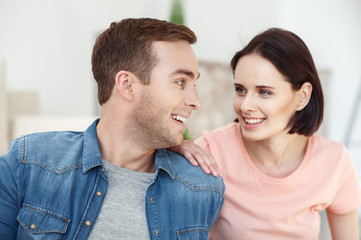 Fototapeta premium Pretty husband and wife are relaxing at home