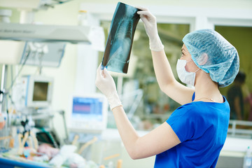intensive care unit female doctor with x-ray image 