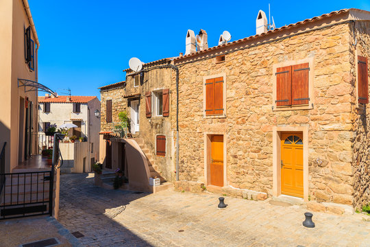 Street with typical French houses in Piana village, Corsica island, France