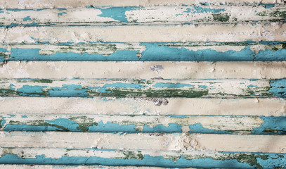 horizontal image of a rustic blank background of tans and blues in a stripe pattern .