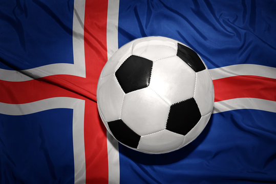 black and white football ball on the national flag of iceland