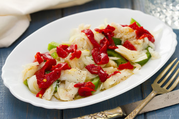 fish with pepper on white dish