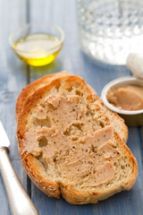 bread with fish pate on blue background