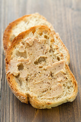bread with fish pate on brown background
