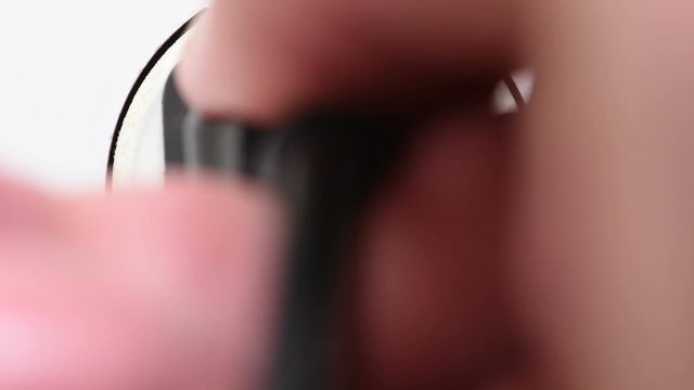 Plug in electronic into outlet closeup