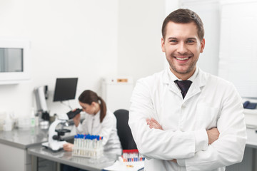 Successful male researcher is expressing positive emotions