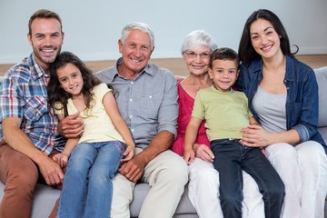 Fototapeta premium Family sitting on sofa