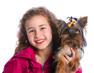 Girl playing with her yorkshire terrier