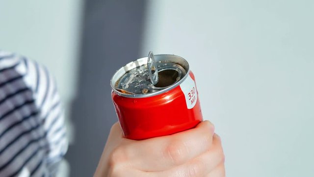 Woman Opens A Soda Can