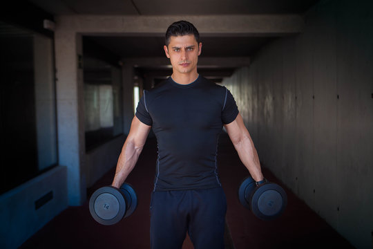 strong healthy man with weights