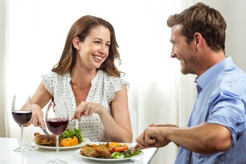 Obraz na płótnie Canvas Happy couple having lunch at home