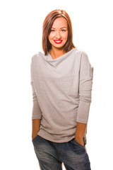 Fototapeta premium Beautiful happy young woman standing with hands in pockets.