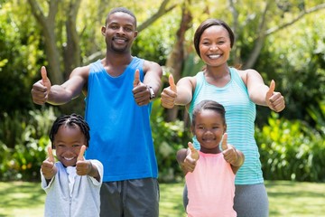 Happy family doing thumbs up