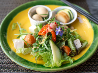 green vegetables salad and chopsticks