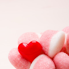 Pink jellies or marshmallows with sugar closeup