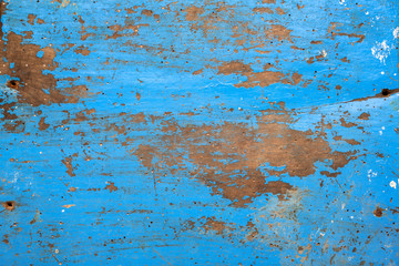 texture/background - blue wooden board with chipping paint and scratches