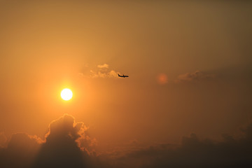 airplane with sunset sky