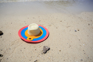 Fototapeta na wymiar Colorful hat on the beach