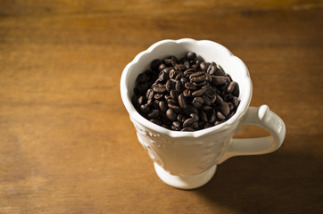 Coffee beans in a fancy mug