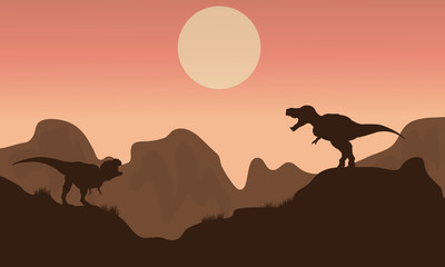 Fototapeta na wymiar Silhouette of T-rex in cliff with sun