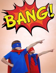 Obraz premium Composite image of masked kids pretending to be superheroes