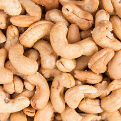 Salted roasted peanuts texture background