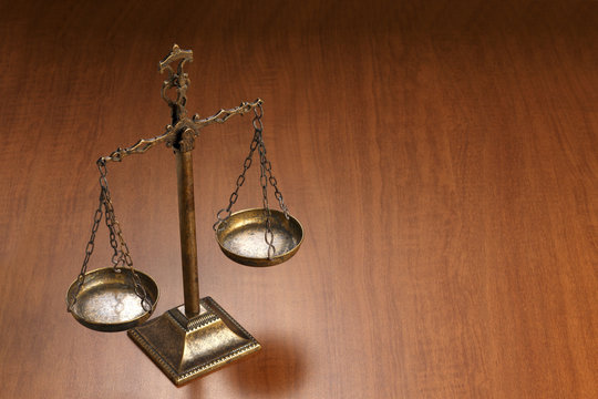 Justice Scale on wood table