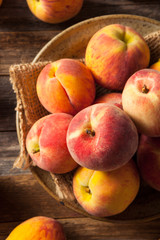 Fototapeta na wymiar Fresh Juicy Organic Yellow Peaches
