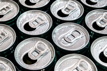 Group of aluminum cans with water drop