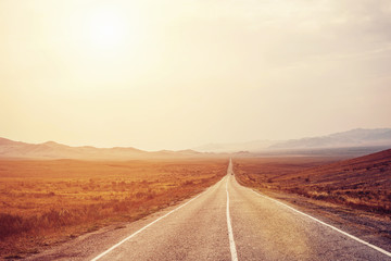 Long Road to mountains horizon. Big way for car travel