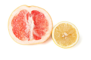 Halfes of grapefruit and lemon isolated on white