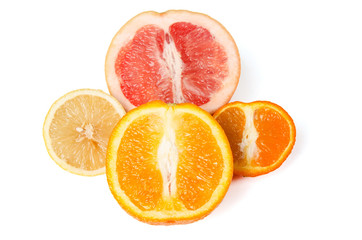 Halfes of grapefruit, orange, lemon and mandarin isolated on white