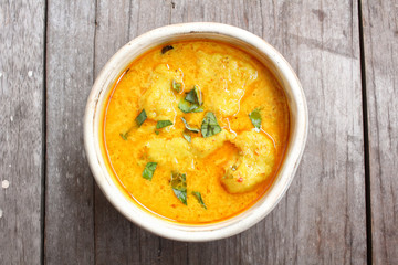 Stewpot of Indian curry and spices.