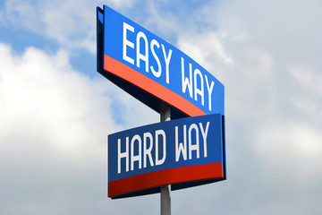 Easy and hard way street sign