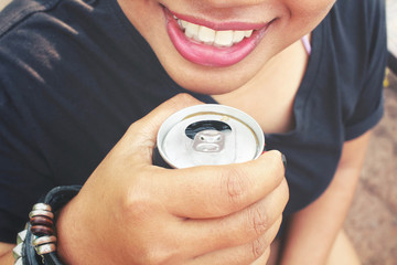Fototapeta premium Woman drinking cola can