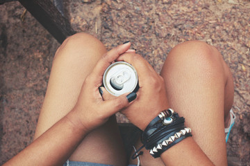 Woman drinking cola can