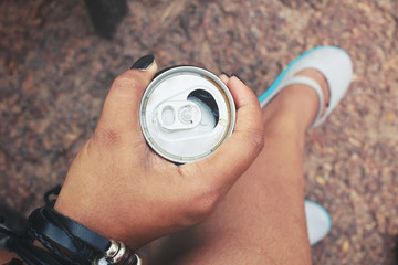 Fototapeta premium Woman drinking cola can
