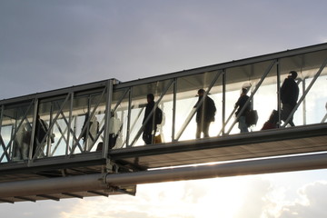 Travelers on jet bridge 