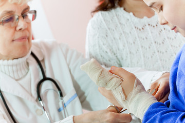 Doctor examining a child in a hospital