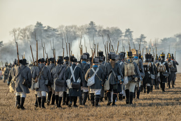 Re-enactors uniformed as soldiers attend the re-enactment of the Battle of the Three Emperors (Battle of Austerlitz) in 1805. - obrazy, fototapety, plakaty