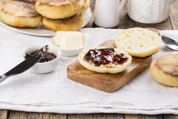 Breakfast. Fresh homemade English muffins with butter and jam