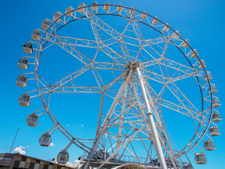 Ferris wheel with blue sky