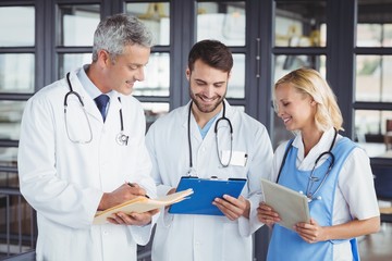 Senior doctor discussing with coworkers
