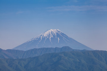 Fototapeta premium Top of Mt. Fuji in spring seen from Kofu city